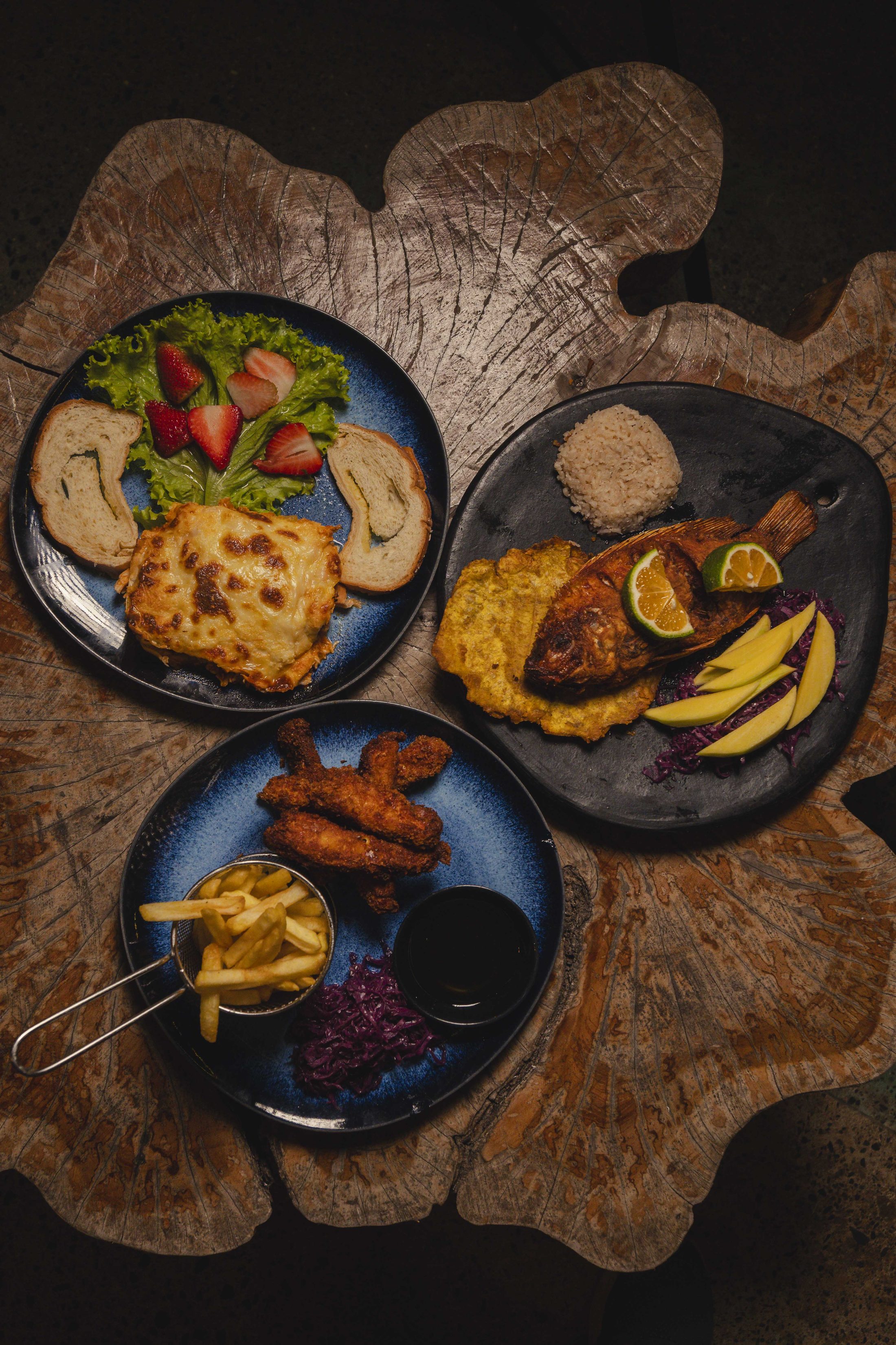 Local cuisine plated on dark wood